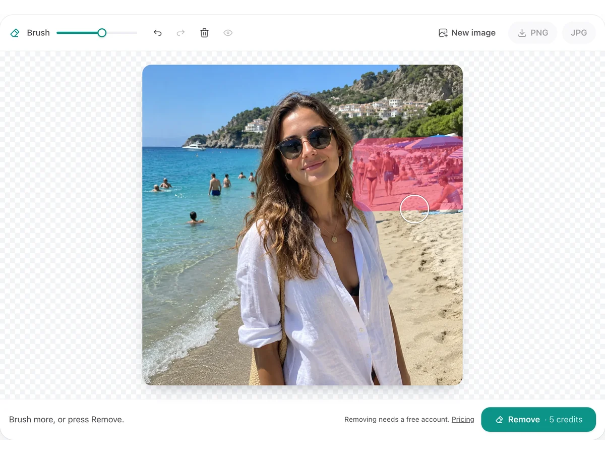 Penghapus PixRemove dengan sapuan kuas di atas orang-orang di pantai