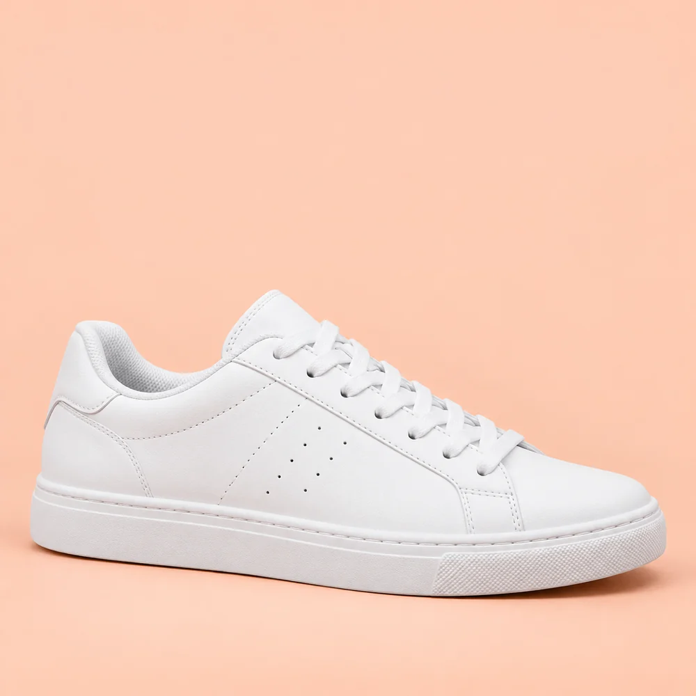 White sneaker on a peach background with sale text — After